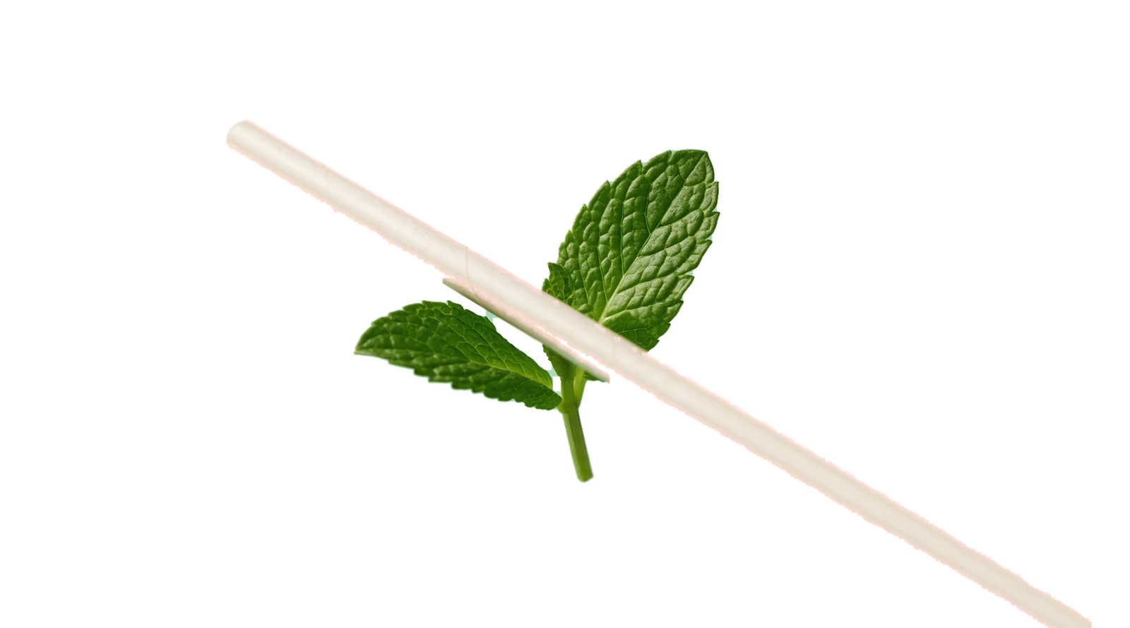 A cup of green juice with a straw